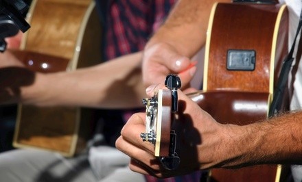 Four or Eight 30-Minute Guitar Lessons at Vez Guitar Academy (Up to 66% Off)