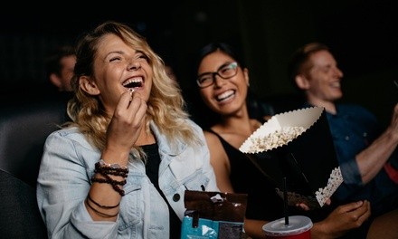 One, Two, or Four Tickets with Popcorn and Drinks at Smitty's Cinema (Up to 50% Off)