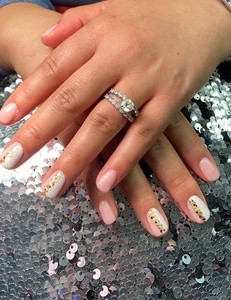 Basic Manicure and Paraffin Treatment or One Full Set of Acrylic Nails at Salon Red Studio (Up to 36% Off)