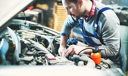 Conventional, Semi-Synthetic, or Synthetic Oil Change at Quick Auto & Exhaust (Up to 59% Off)