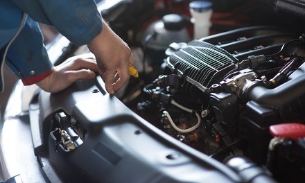 Oil Change or Wheel Alignment at Tuffy Auto Service Center (Up to 58% Off). Four Options Available.