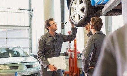 Four-Wheel Alignment or Brake-Pad Replacement at Midas (Up to 39% Off)