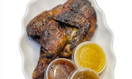 Up to 33% Off on Jamaican Cuisine at Tropics Jerk Center